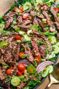 Experience the vibrant and spicy flavors of Thailand with this fresh and savory Thai Beef Salad. Perfectly grilled beef paired with crisp vegetables and a tangy lime-fish sauce dressing makes this dish a light yet fulfilling meal, ideal for lunch or dinner.